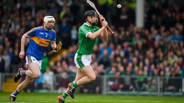 Barry Murphy of Limerick races clear of Séamus Kennedy of Tipperary, as he scores a late goal during the Munster GAA Hurling Senior Championship Round 1 match between Limerick and Tipperary at the Gaelic Grounds in Limerick.